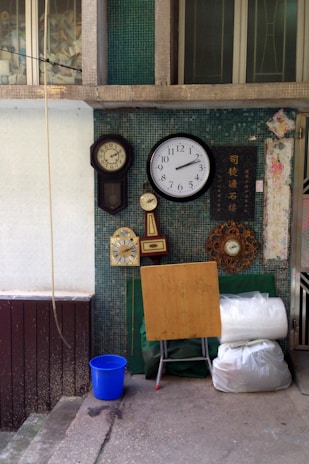 A collection of nxz digital clocks and timers displayed neatly on a shelf.