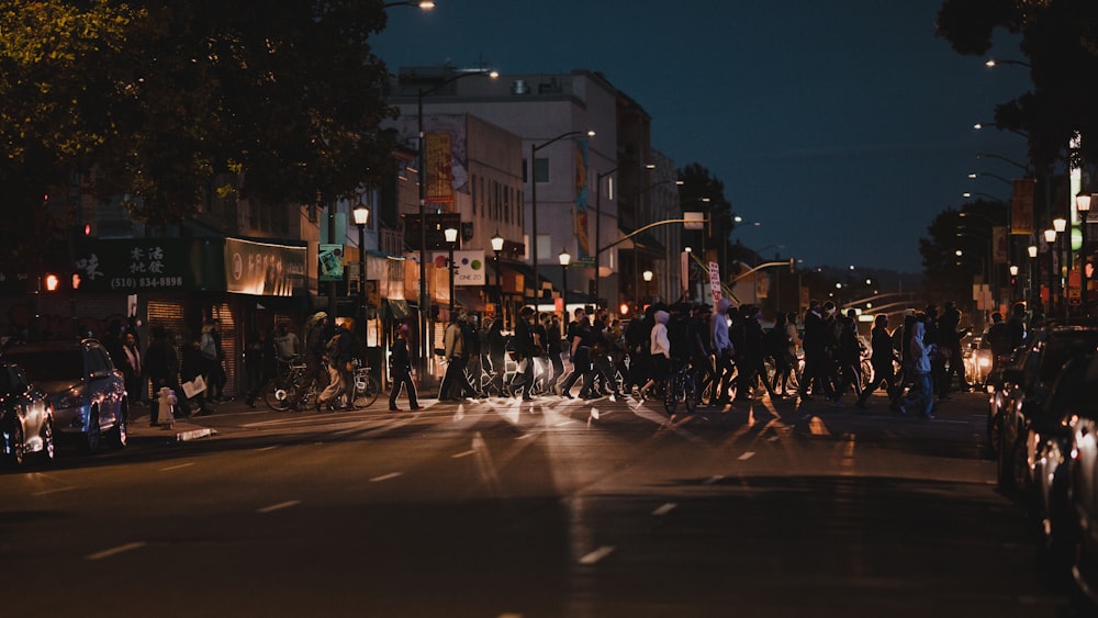 people walking on street during night time