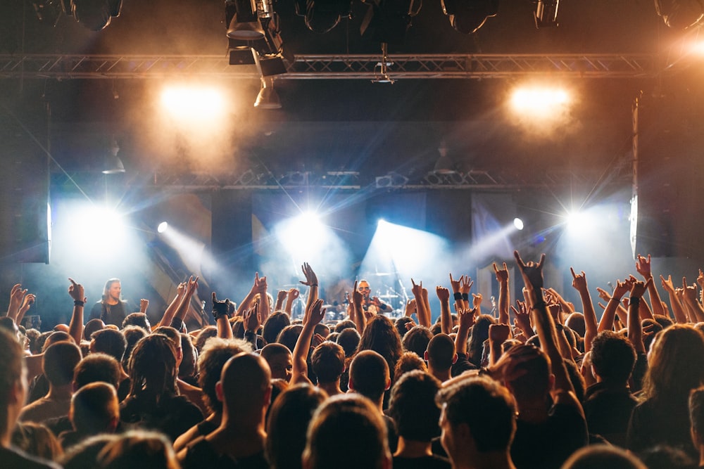 people watching band performing on stage