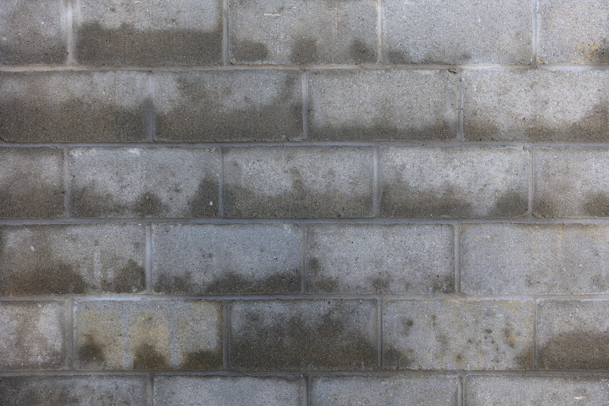 Run of stacked concrete masonry block forming a structural wall