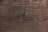 Weathered wooden surface with distinct grain patterns and subtle variations in color.