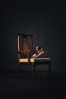 brown wooden chair with book