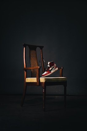 brown wooden chair with book