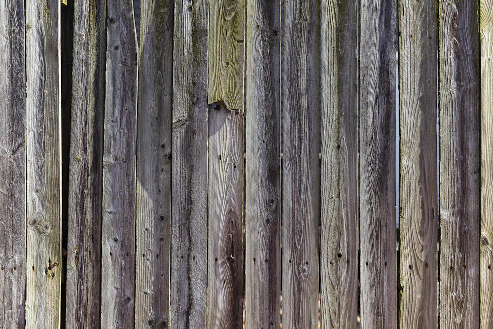 Weathered gray wood fence boards