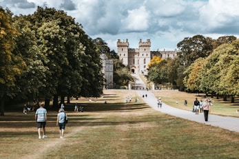 people walking on park near building during daytime