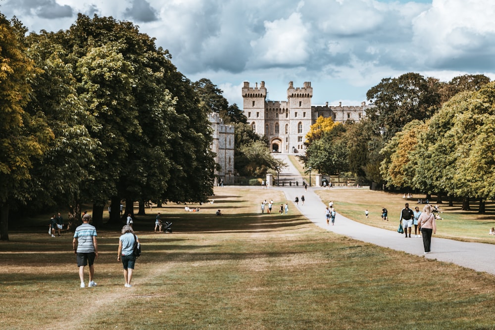 people walking on park near building during daytime