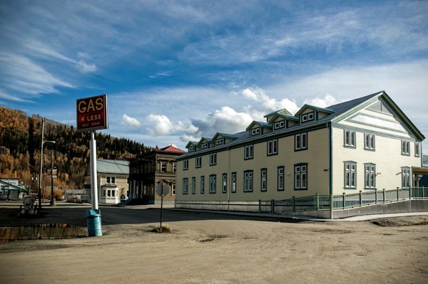 The KIAC art school and a gas station on a dirt street — Dawson City, Canada
