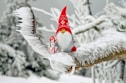 snowman wearing red hat and white scarf