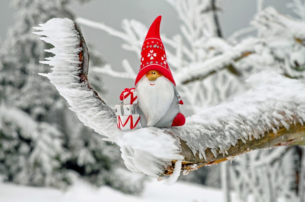 snowman wearing red hat and white scarf