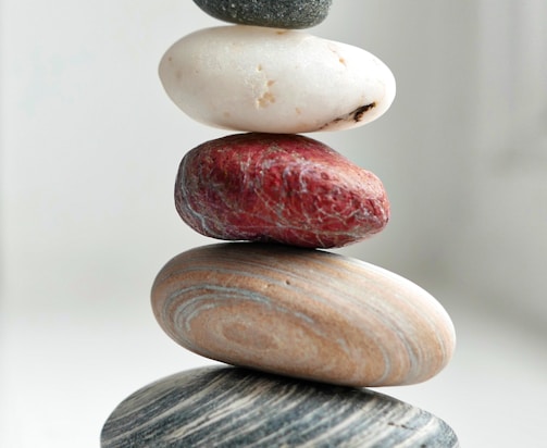 brown and gray stones on white surface