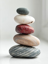 brown and gray stones on white surface