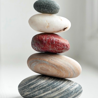 brown and gray stones on white surface