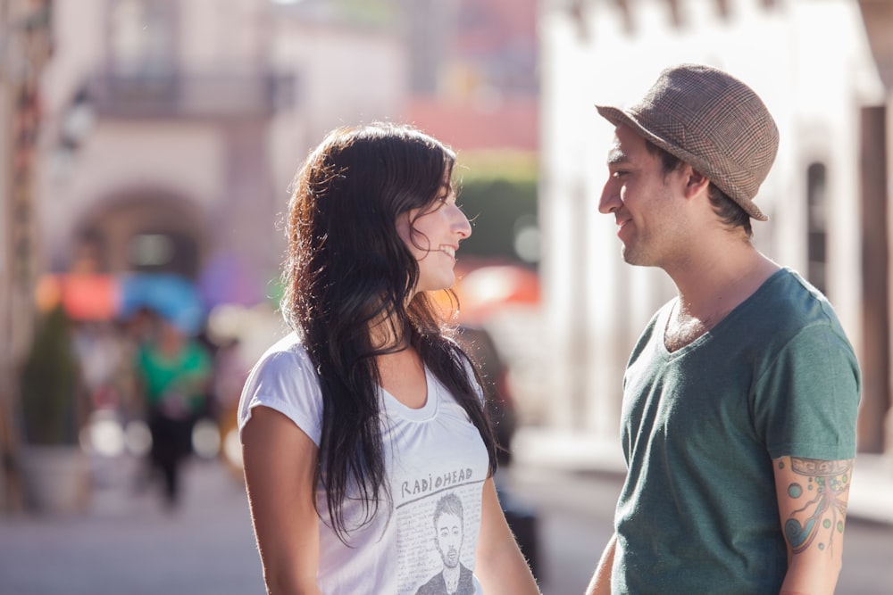 woman in white crew neck t-shirt and brown fedora hat