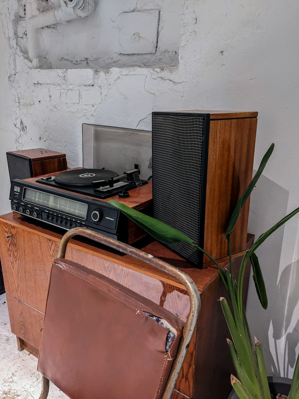 black and brown radio on brown wooden table