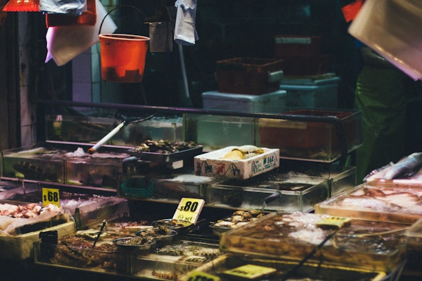 Close-up of fresh seafood displayed on ice at a market stall.