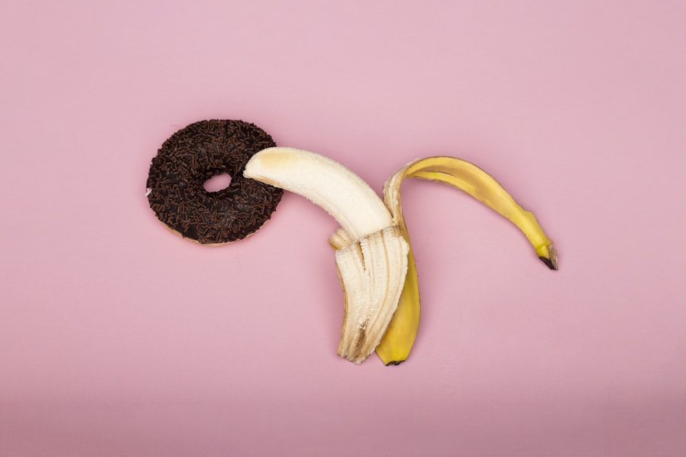 yellow banana fruit on purple surface