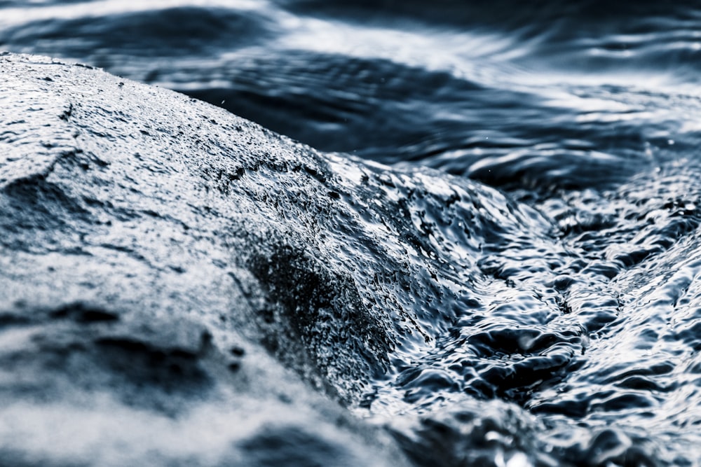 water waves on gray rock