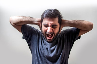 man in black crew neck t-shirt angry google meet background