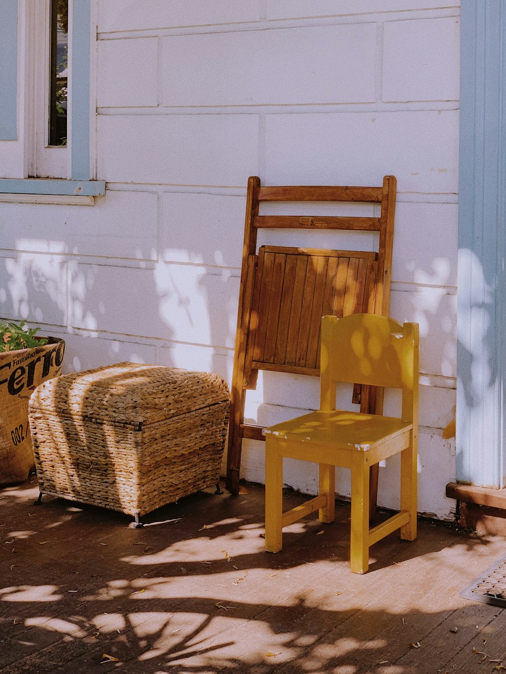 brown wooden chair beside brown woven basket