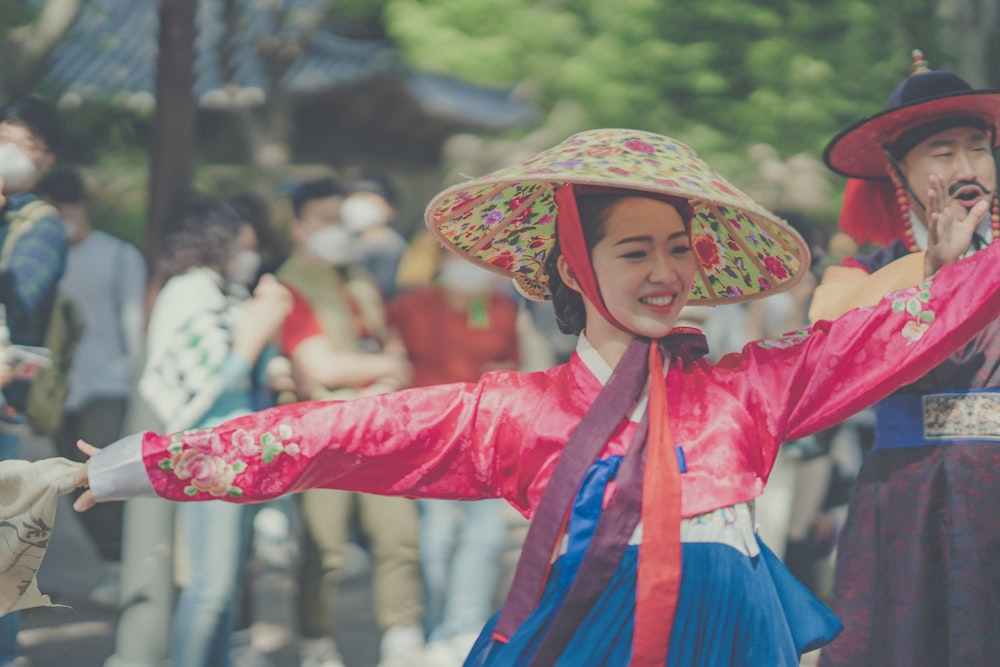 woman in pink long sleeve shirt and blue and white hat