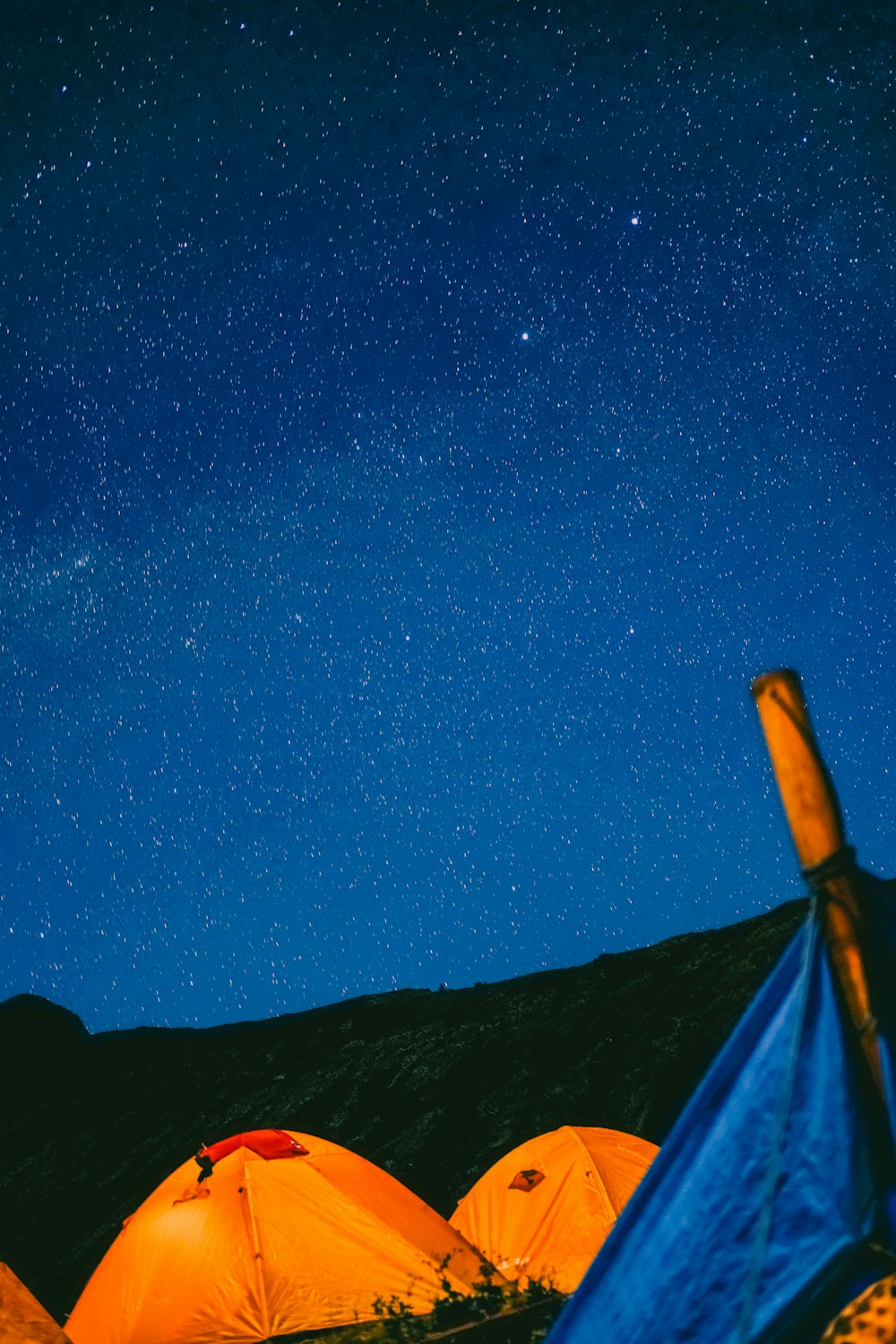 brown wooden post under blue sky during night time