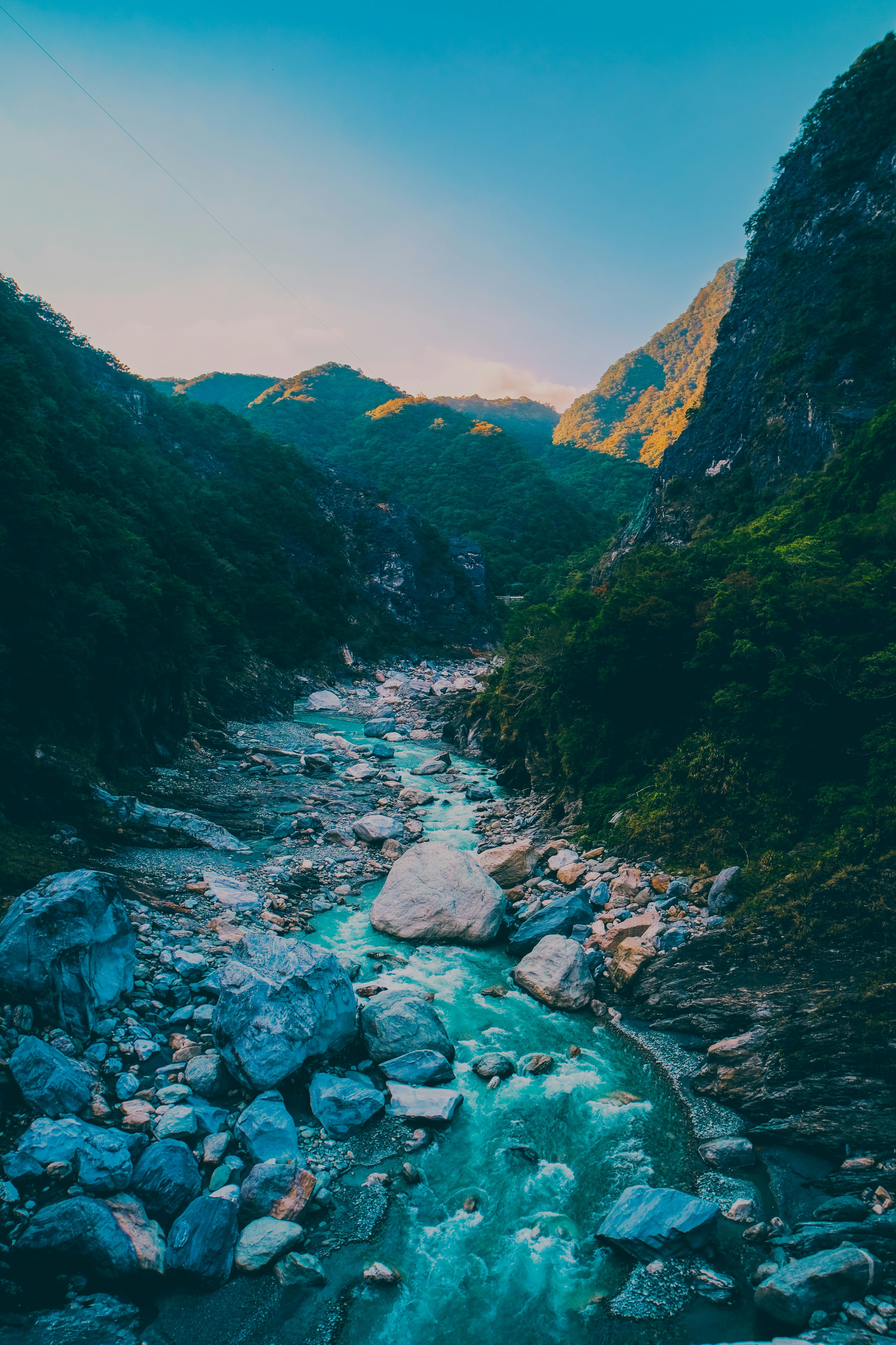 green mountains and river during daytime