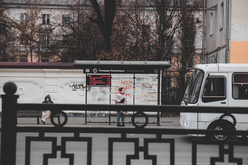 white and black bus on road during daytime