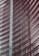 Steel and glass building facade with red horizontal slats creating a dynamic, modern architectural design.