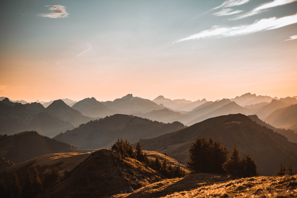 brown and green mountains under blue sky during daytime