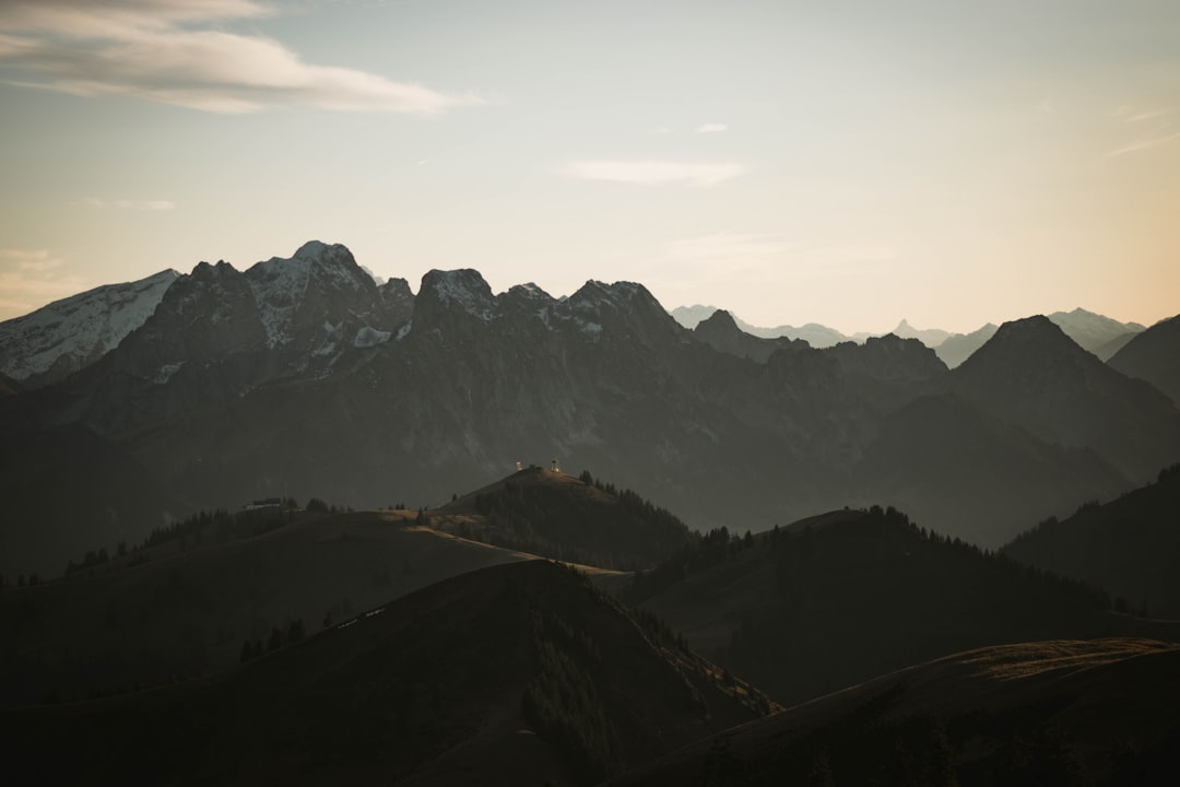 brown and green mountains under white sky during daytime