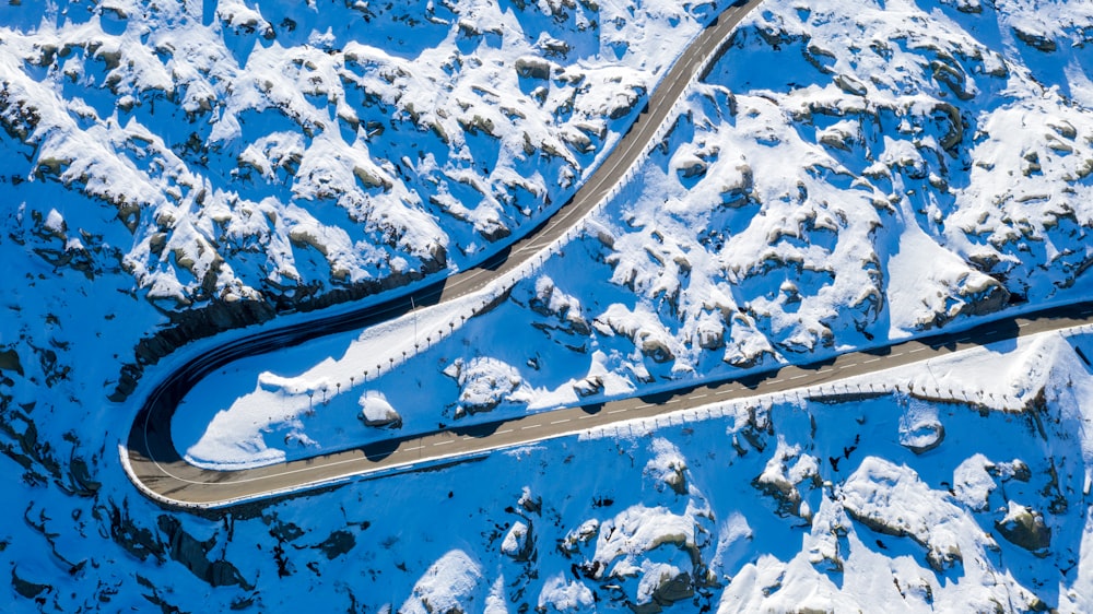 aerial view of snow covered road during daytime