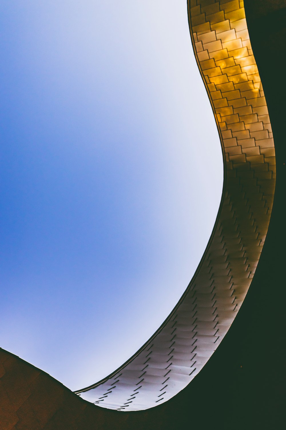 white and brown concrete building under blue sky during daytime