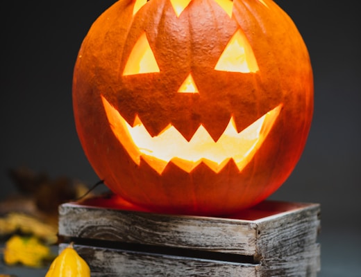 jack o lantern on brown wooden table