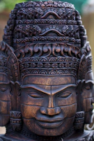 Elegant wooden statue of an African elder, showcasing detailed craftsmanship.