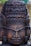 A beautifully crafted wooden statue showcasing intricate carvings and rich textures.