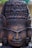 A beautifully crafted wooden statue showcasing intricate carvings and rich textures.