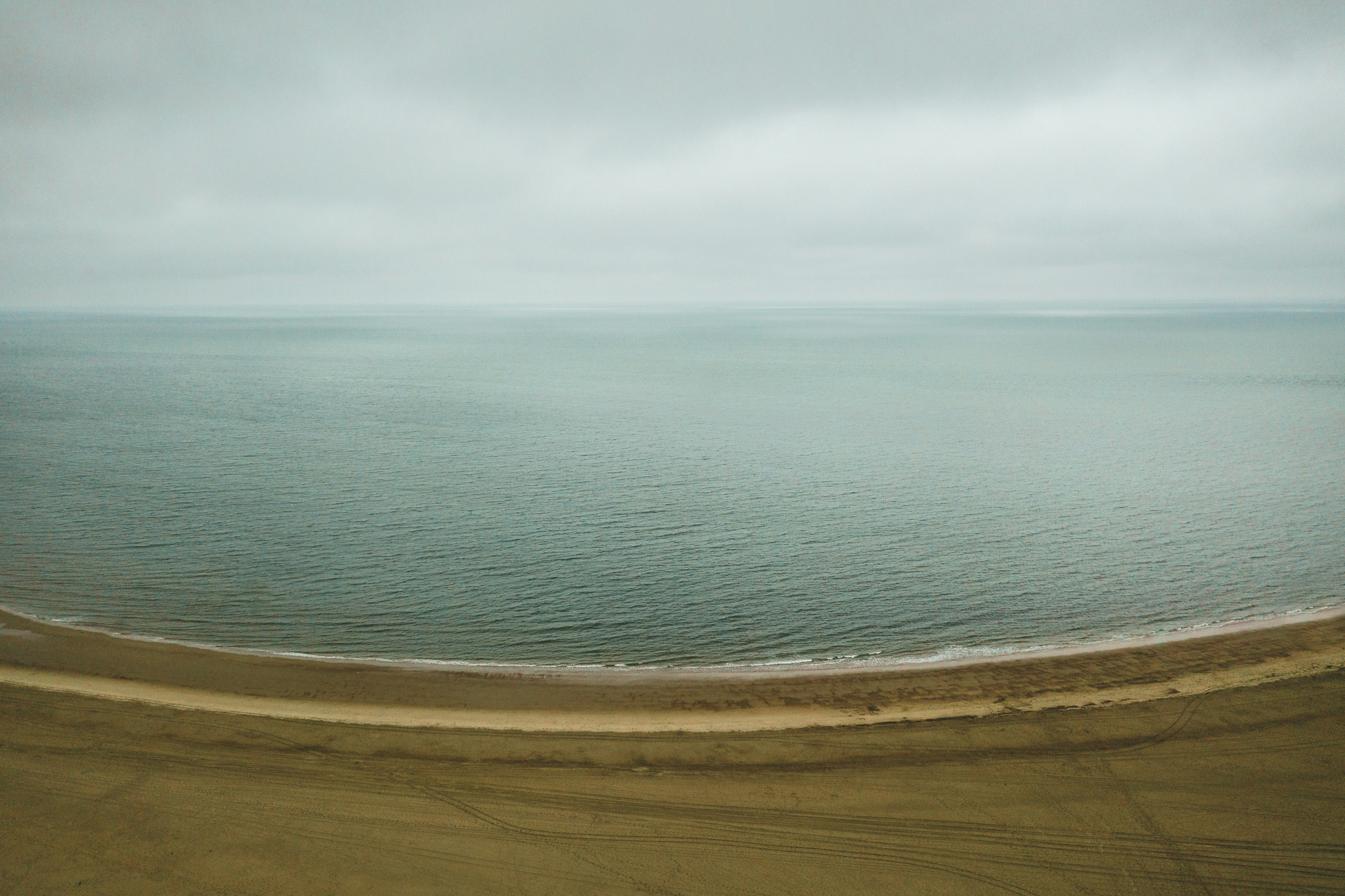 blue sea under white clouds during daytime