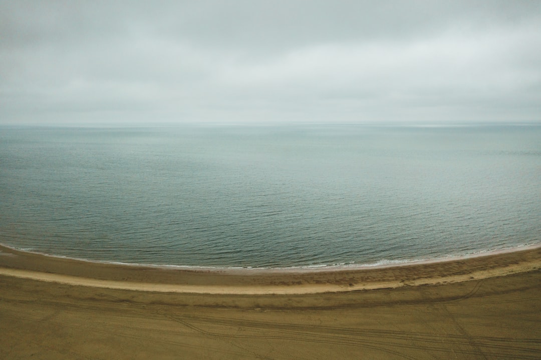 blue sea under white clouds during daytime