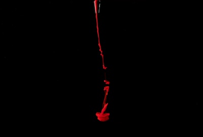 A live stream screenshot showing a passionate speaker sharing insights about blood over intent in front of an engaged audience.