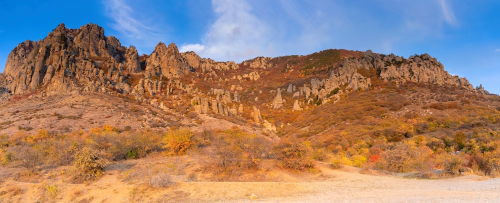 brown rocky mountain under blue sky during daytime