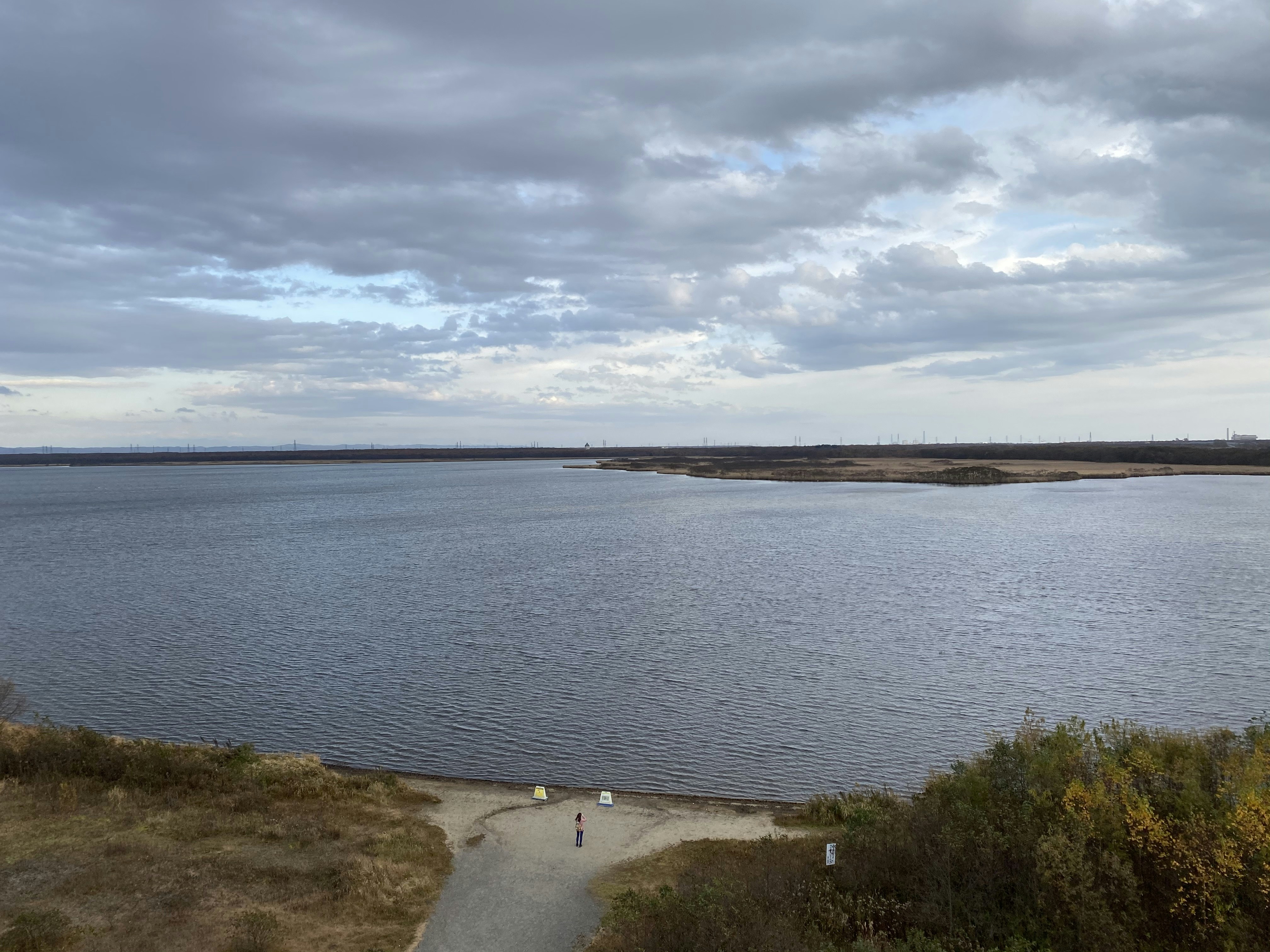 body of water under cloudy sky during daytime