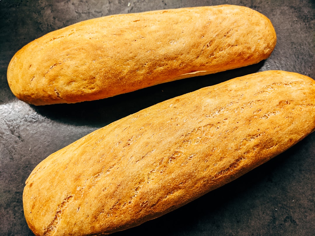 2 brown bread on black table