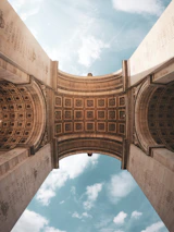 low angle photography of brown concrete building under blue sky during daytime