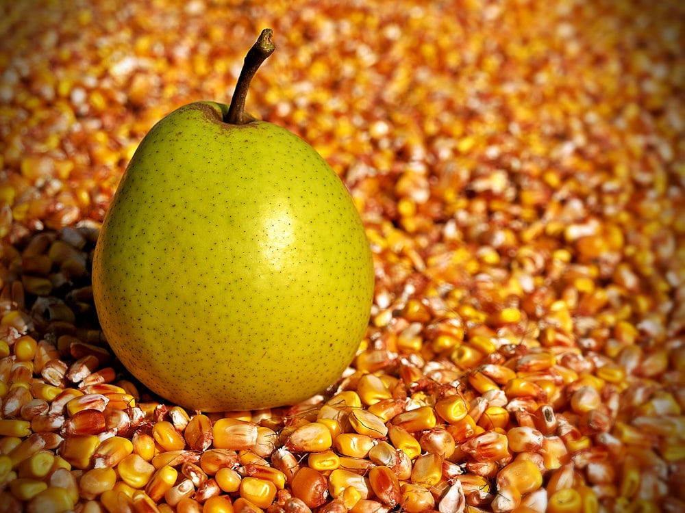 green apple on yellow and brown beads