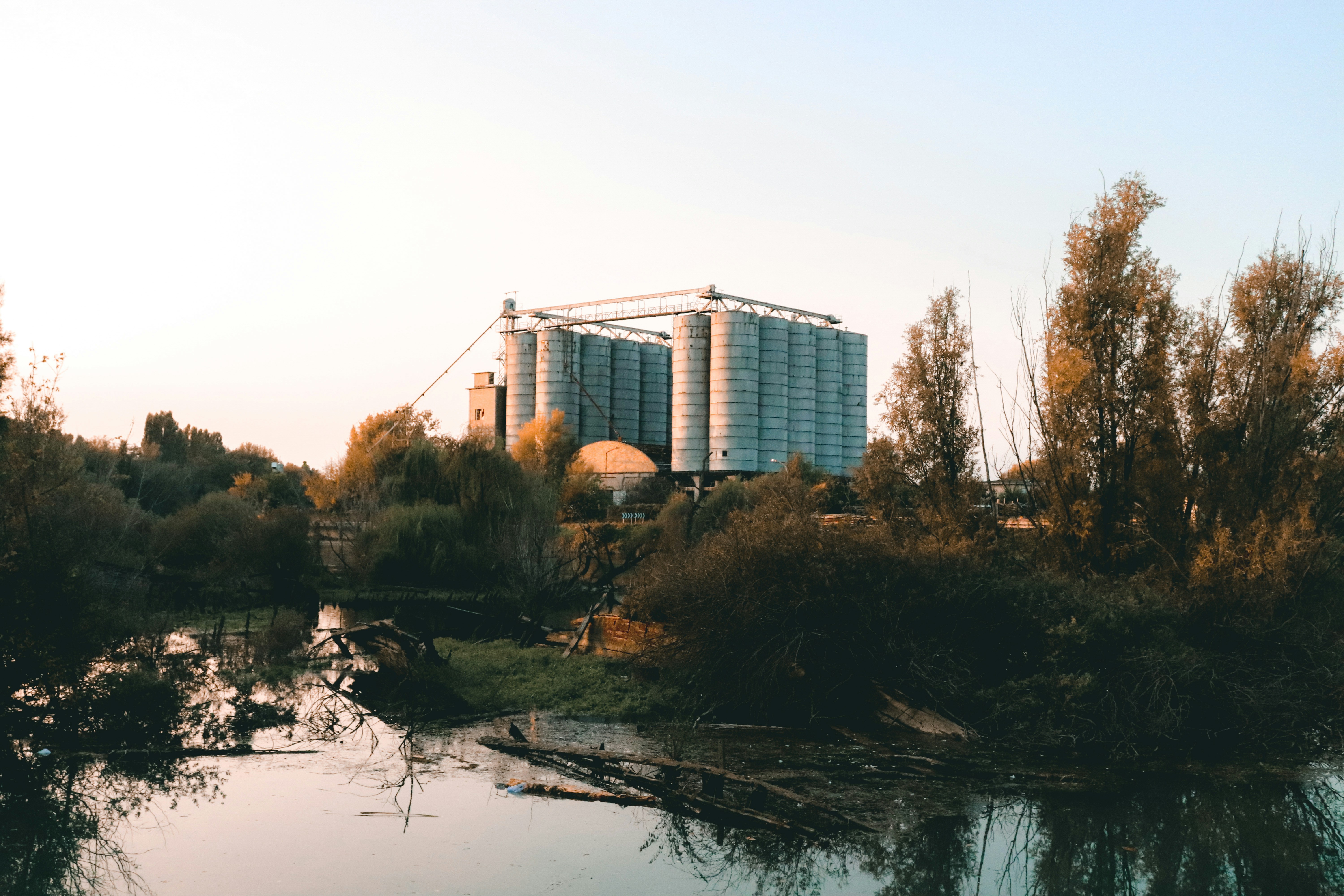 white concrete building near body of water during daytime