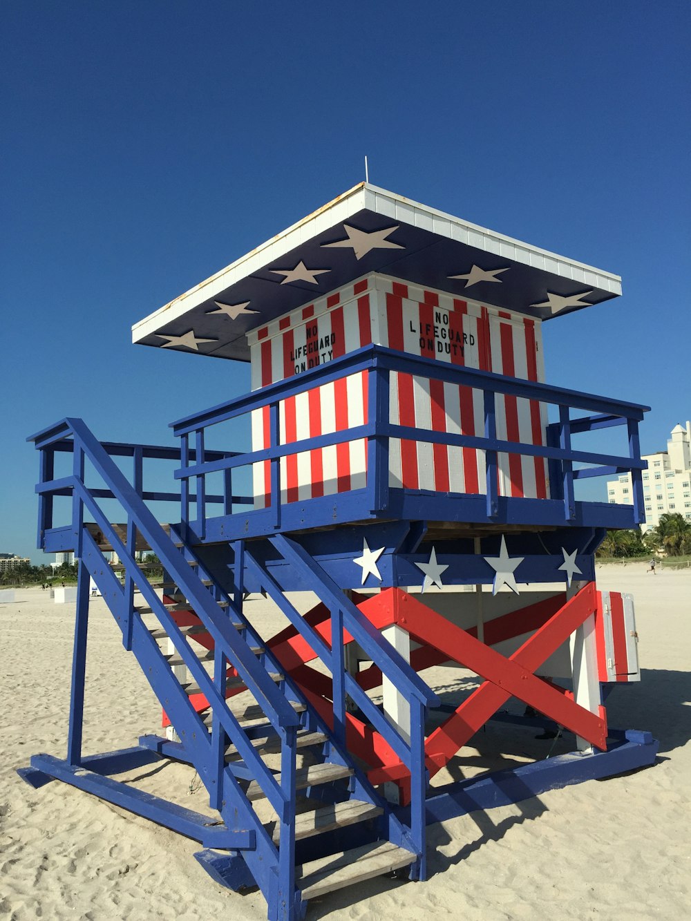 blue and red wooden house under blue sky during daytime