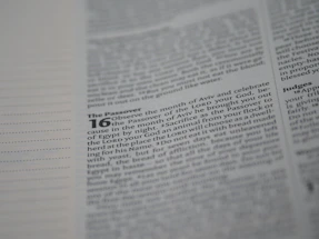 A close-up of a page from a religious text, focusing on passages related to the Passover with certain words highlighted in bold.