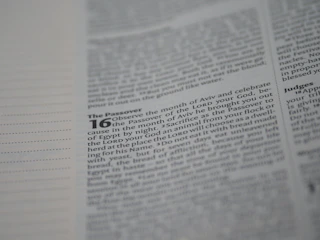 A close-up of a page from a religious text, focusing on passages related to the Passover with certain words highlighted in bold.