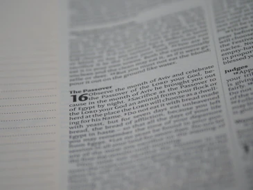 A close-up of a page from a religious text, focusing on passages related to the Passover with certain words highlighted in bold.