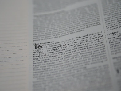 A close-up of a page from a religious text, focusing on passages related to the Passover with certain words highlighted in bold.